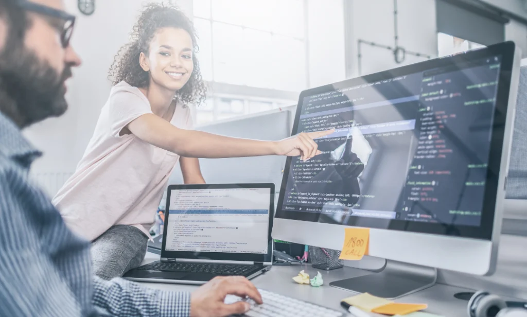 Developers fixing website performance issues to improve ROI and conversions